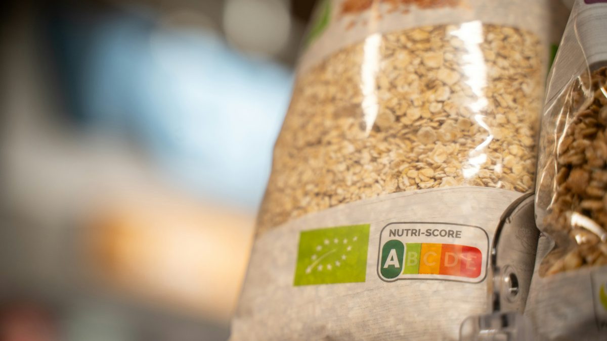 A bag of oats on a supermarket shelf showing certification labels