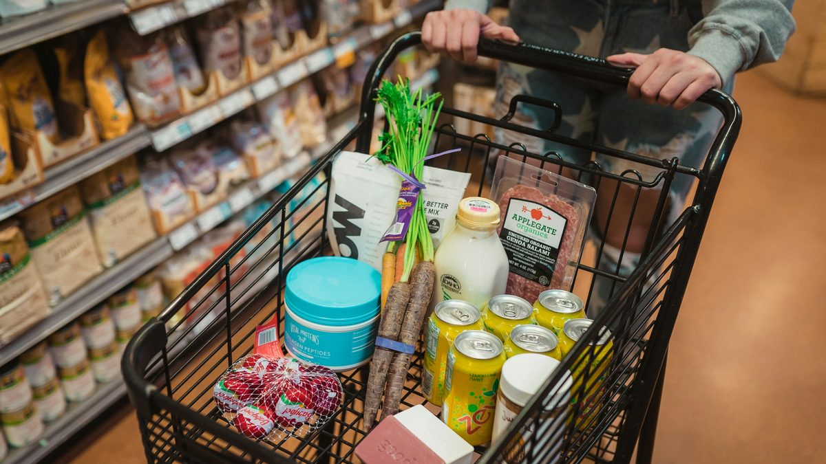 A supermarket trolley filled with groceries