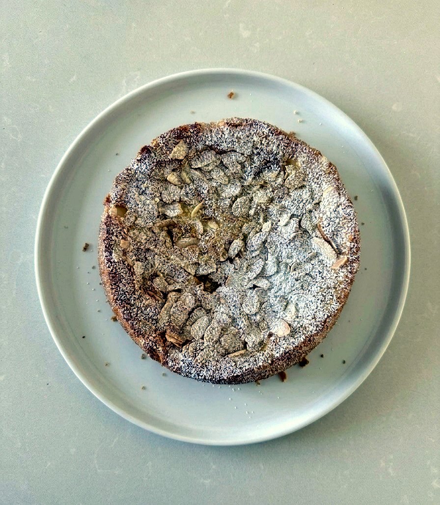 The whole cake from above — that signature flaked-almond top